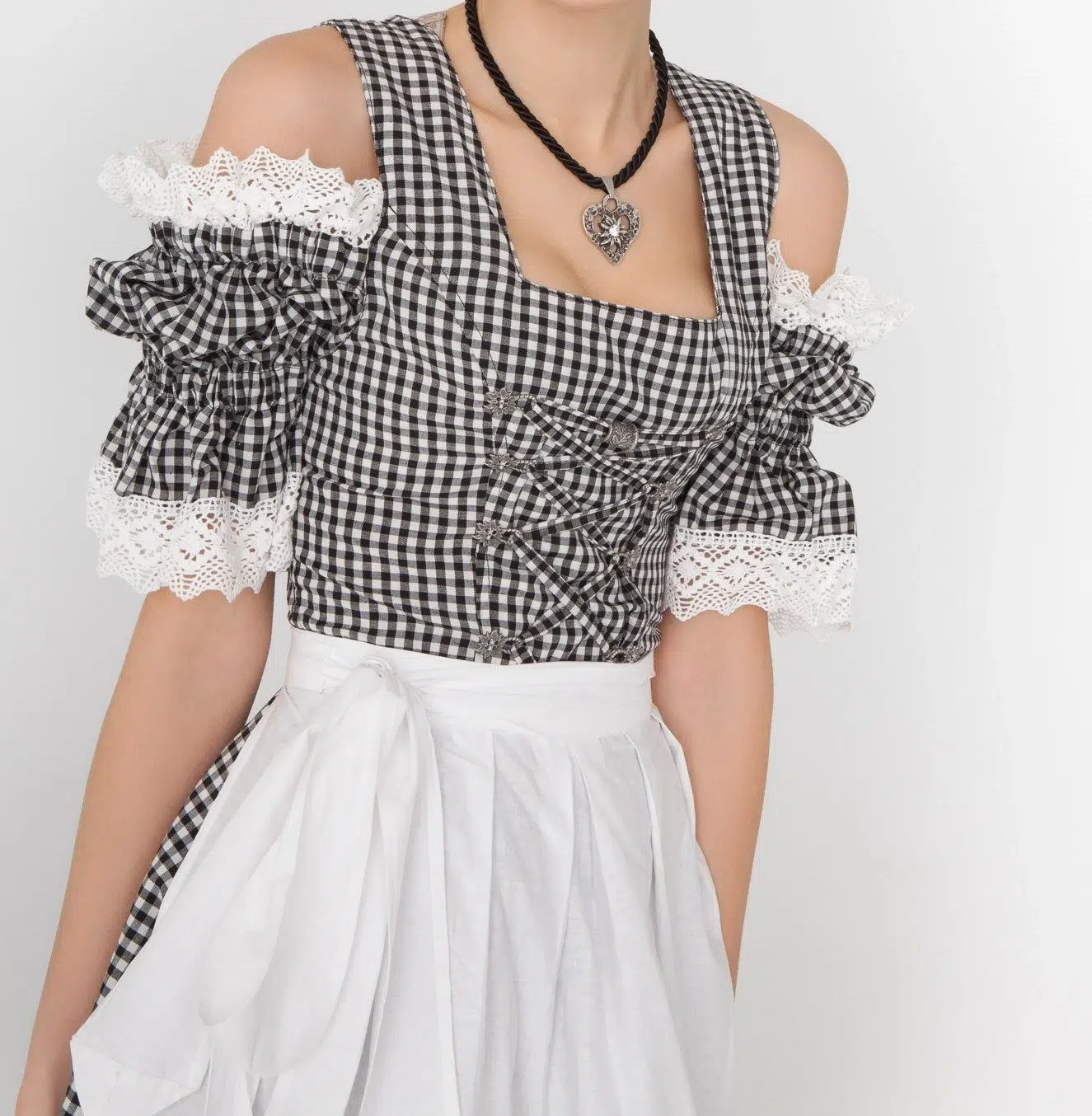 Dirndl Mara 3 Woman in black checkered Dirndl with white apron. - Lederhosen For Sale