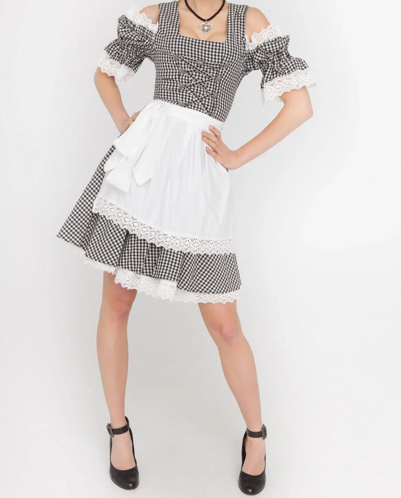 Dirndl Mara 2 Woman posing in black checkered Dirndl with white apron. - Lederhosen For Sale