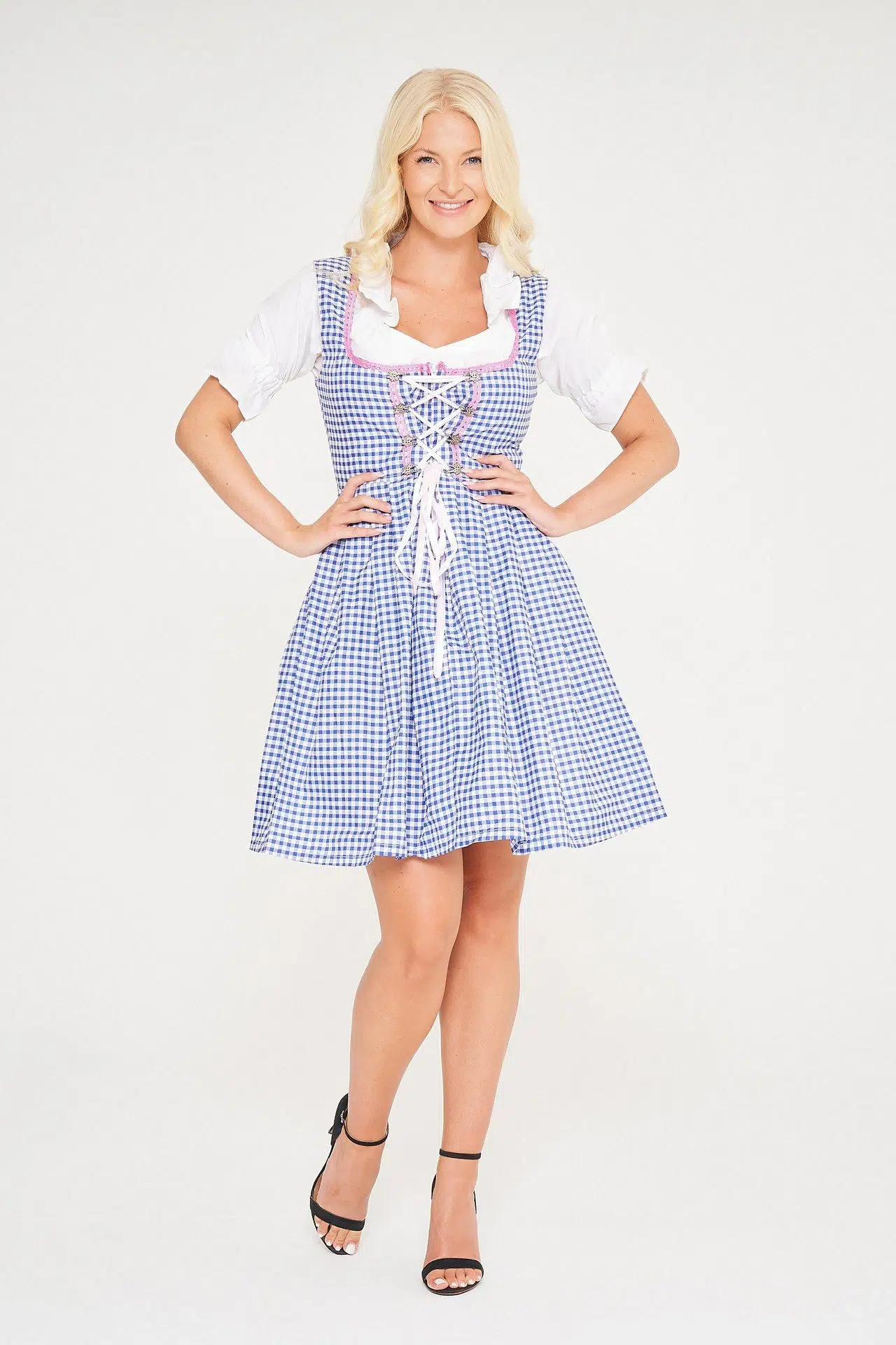 Blonde woman posing in sky blue checkered midi Dirndl. - Lederhosen For Sale