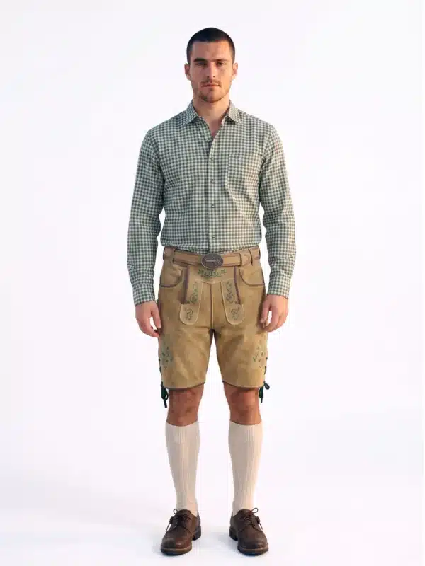 Man wearing light gold handcrafted Lederhosen shorts with a matching belt, large ornate buckle, and a green checkered shirt. - Lederhosen For Sale