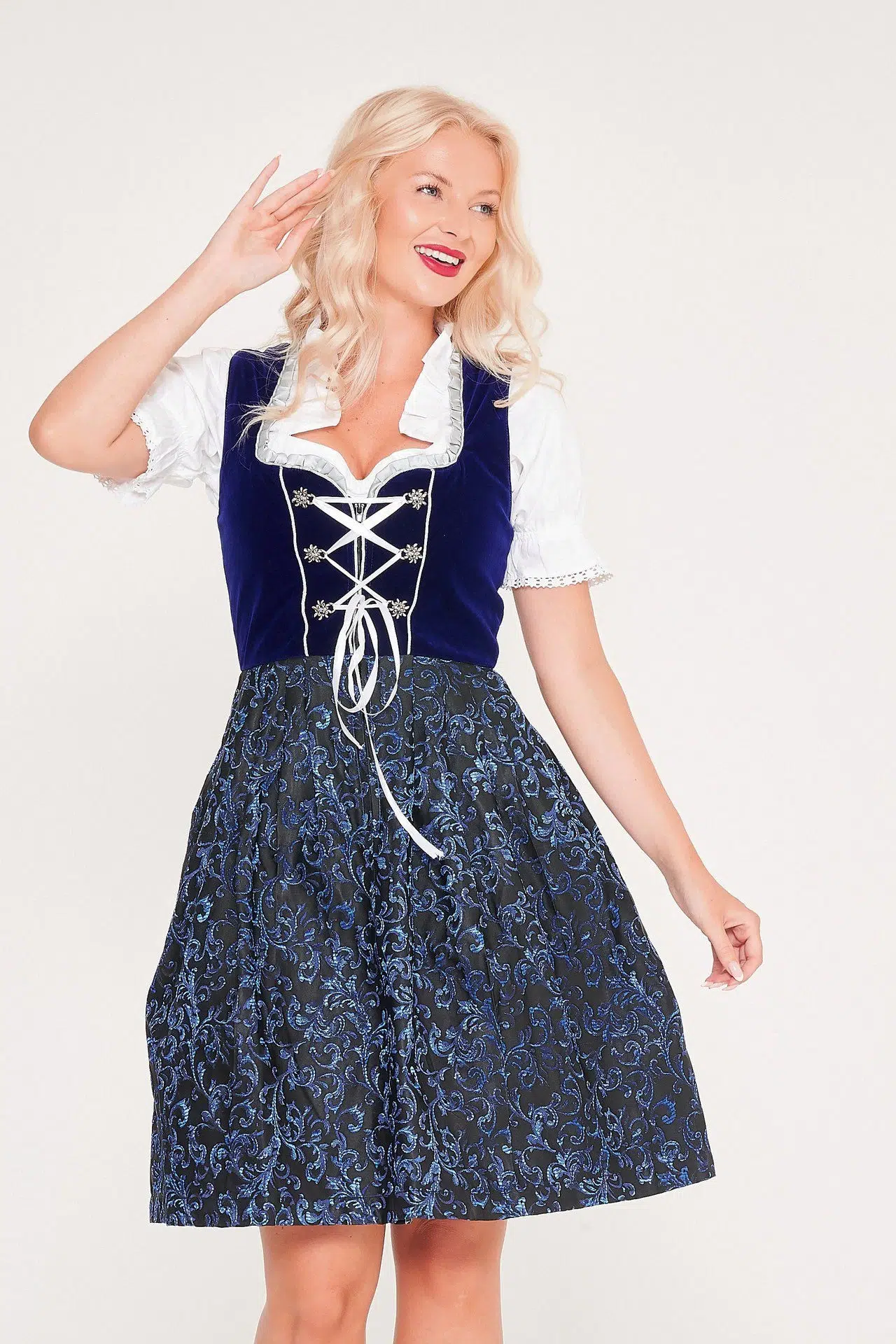 Blonde woman posing in dark blue traditional Dirndl dress. - Lederhosen For Sale